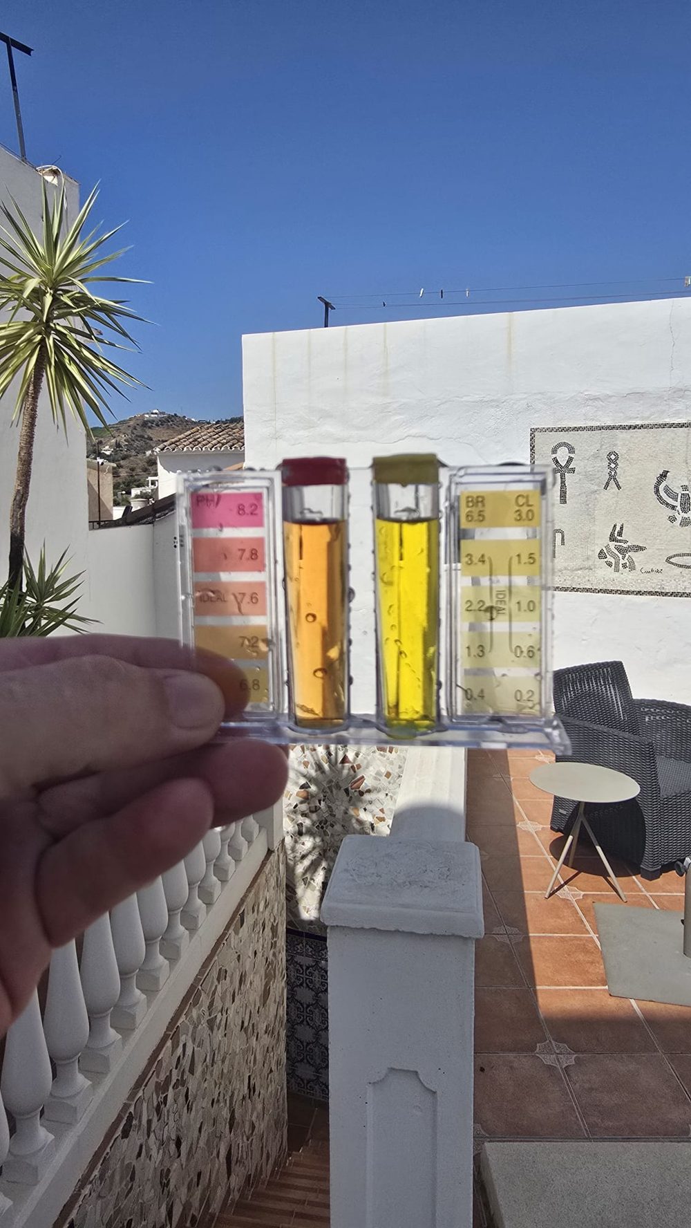 Pool water test kit showing pH and chlorine readings at a Marbella villa